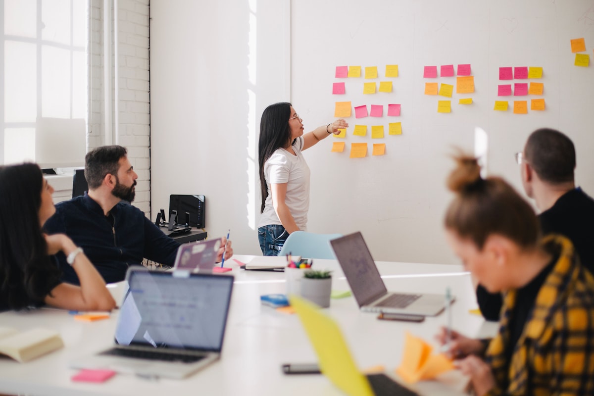Marketing team reviewing campaign strategy in a modern Singapore agency office