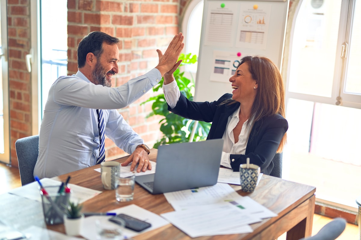 Senior marketing advisor presenting strategy recommendations to a client team